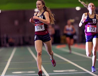 Ashley Tymkow, left, and Kiana Row coming into the finish line in the women&rsquo;s 3000. Photo by Robert Antoniuk